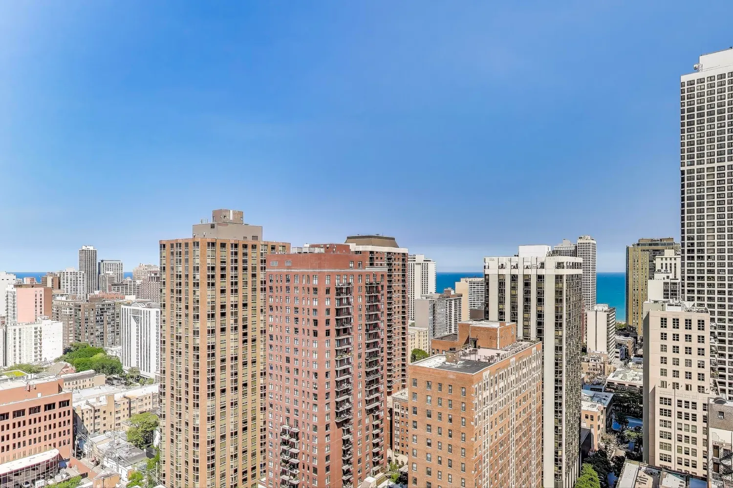 a view of city with tall buildings