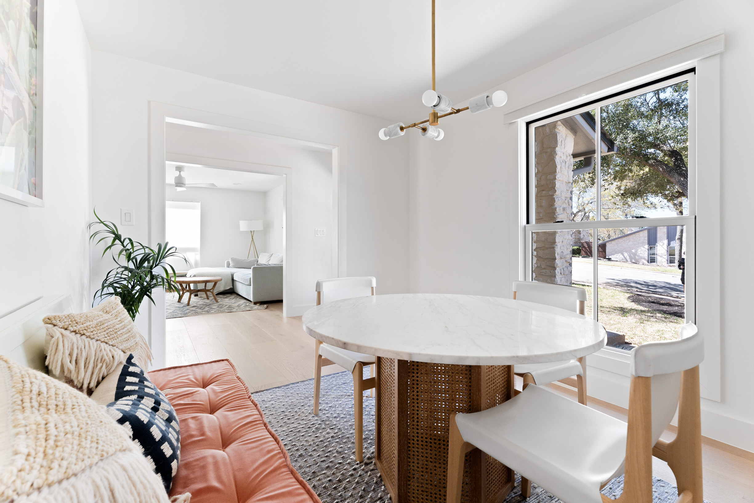 1317 Thaddeus Cove Austin, TX 78746 - Photo 10 of 22 a living room with furniture a table and decor