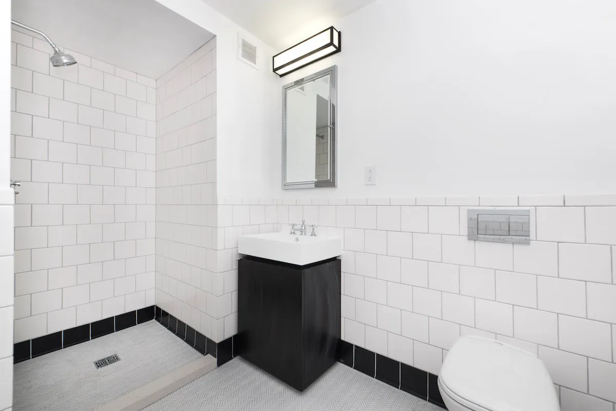 a bathroom with a toilet and a sink