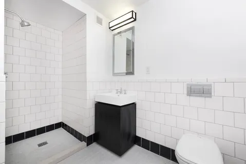 a bathroom with a toilet and a sink