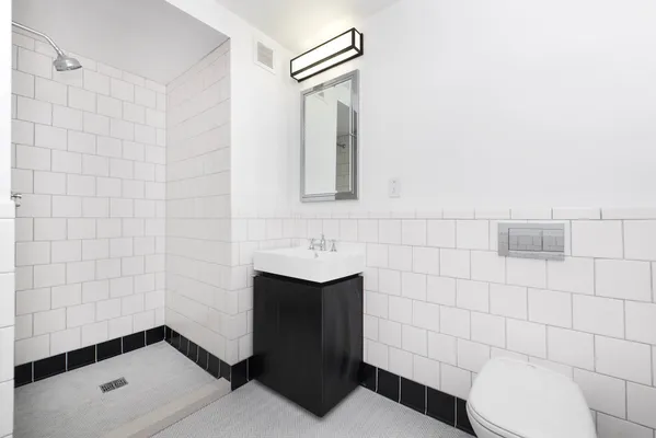 a bathroom with a toilet and a sink