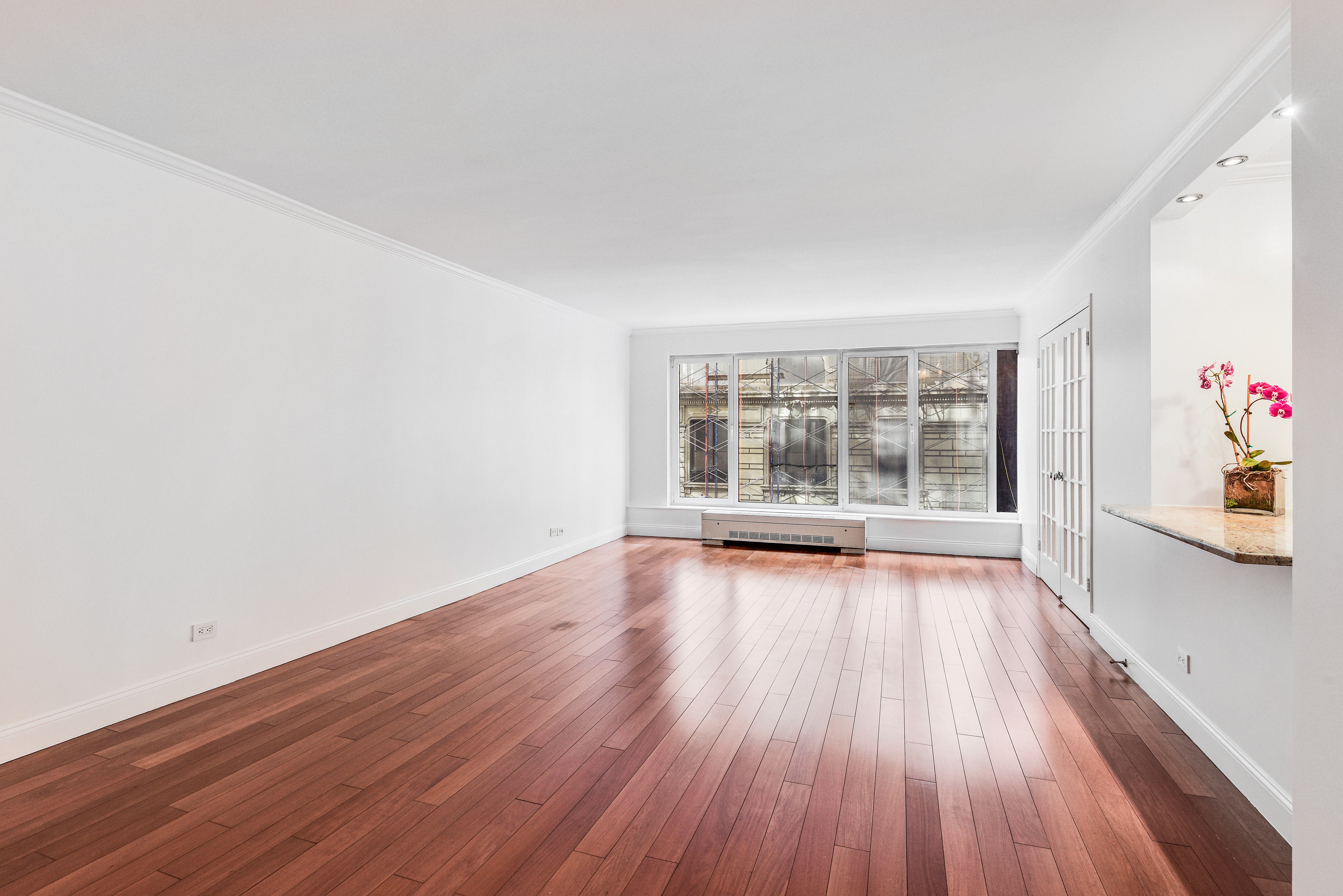 200 Central Park South, Unit 5M Manhattan, NY 10019 - Photo 4 of 15 wooden floor in an empty room with a window