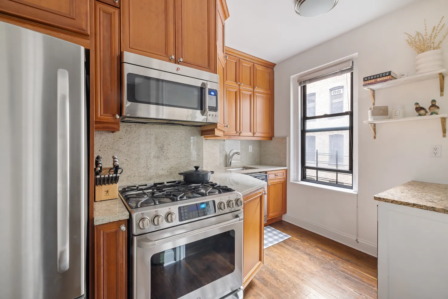 a kitchen with a stove microwave and refrigerator