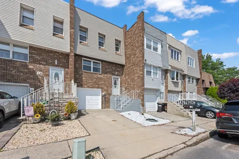 a view of a brick building next to a yard