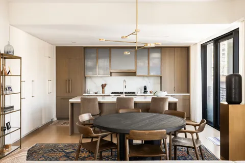 a kitchen with a table and chairs in it