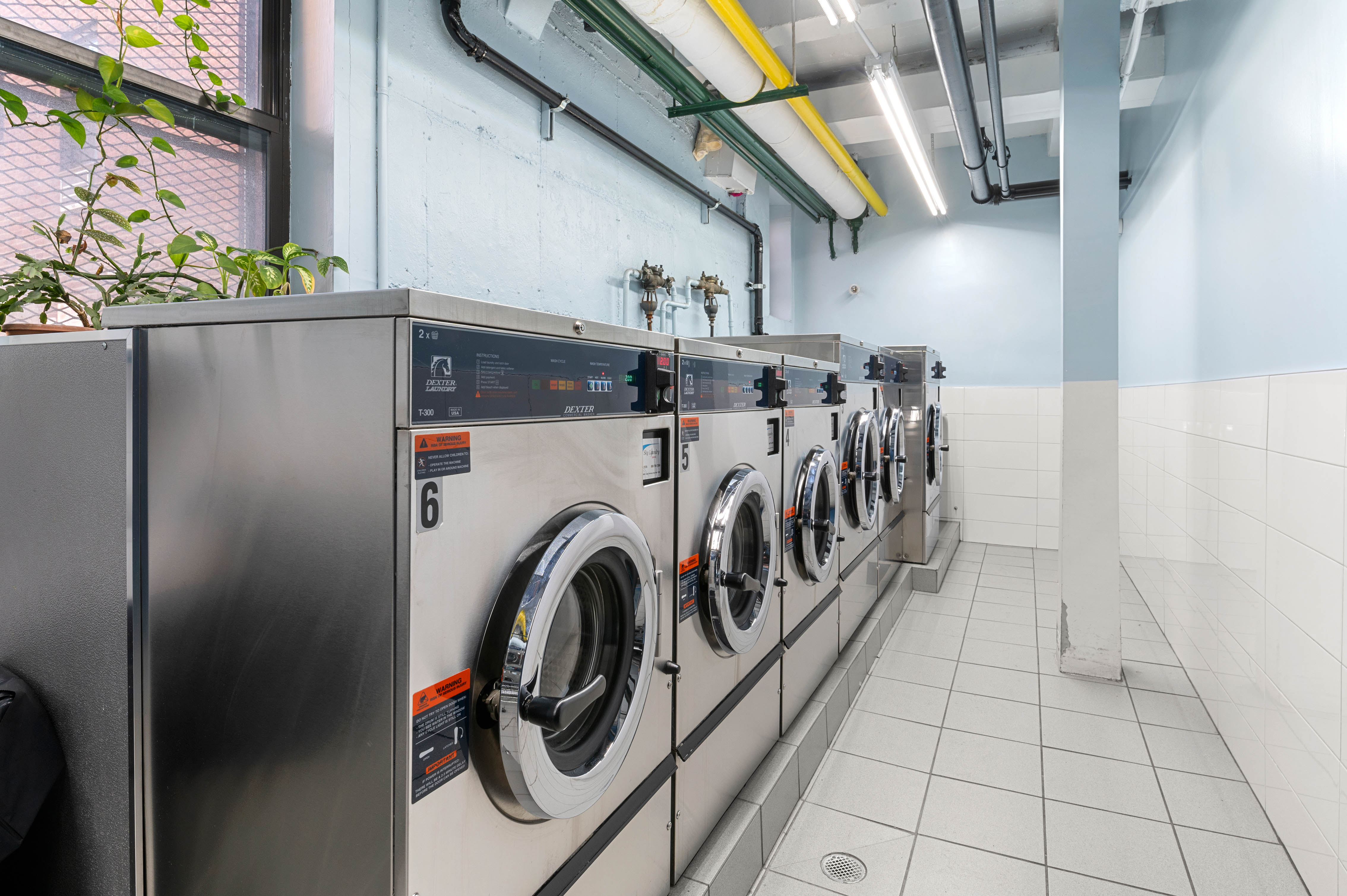 65-15 38th Avenue, Unit 1G Queens, NY 11377 - Photo 9 of 12 a view of a storage & utility room with washer and dryer