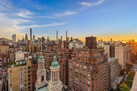 a view of a city with tall buildings