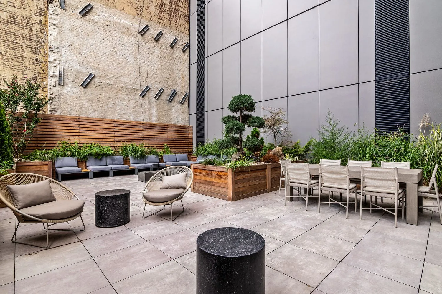 a outdoor space with lots of potted plants and a couch