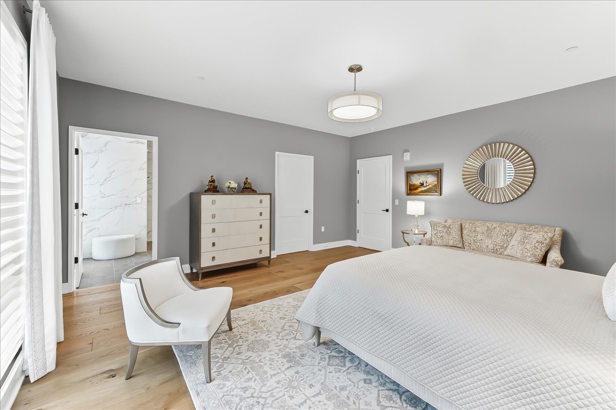 427 East Lancaster Avenue Wayne, PA 19087 - Photo 22 of 35 a bedroom with a bed and mirror