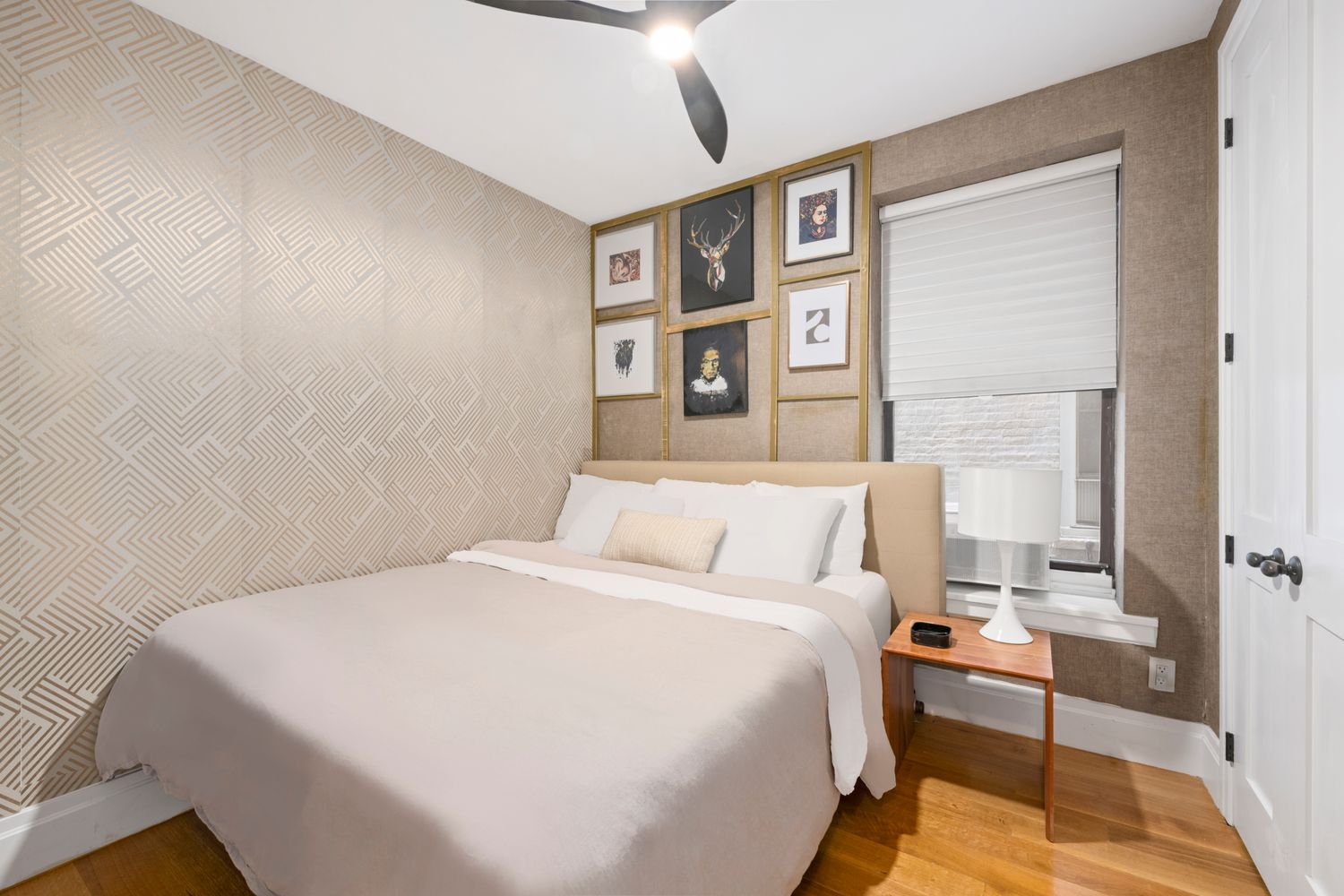 a bedroom with a bed and a desk