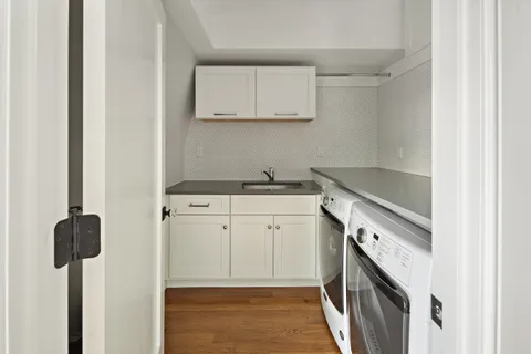 a kitchen with a sink and cabinets