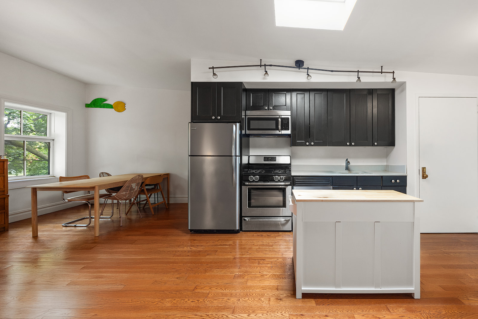 54 Cheever Place Brooklyn, NY 11231 - Photo 23 of 25 a kitchen with kitchen island a counter top space appliances and a window