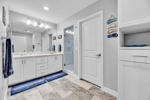 a spacious bathroom with a double vanity sink mirror and