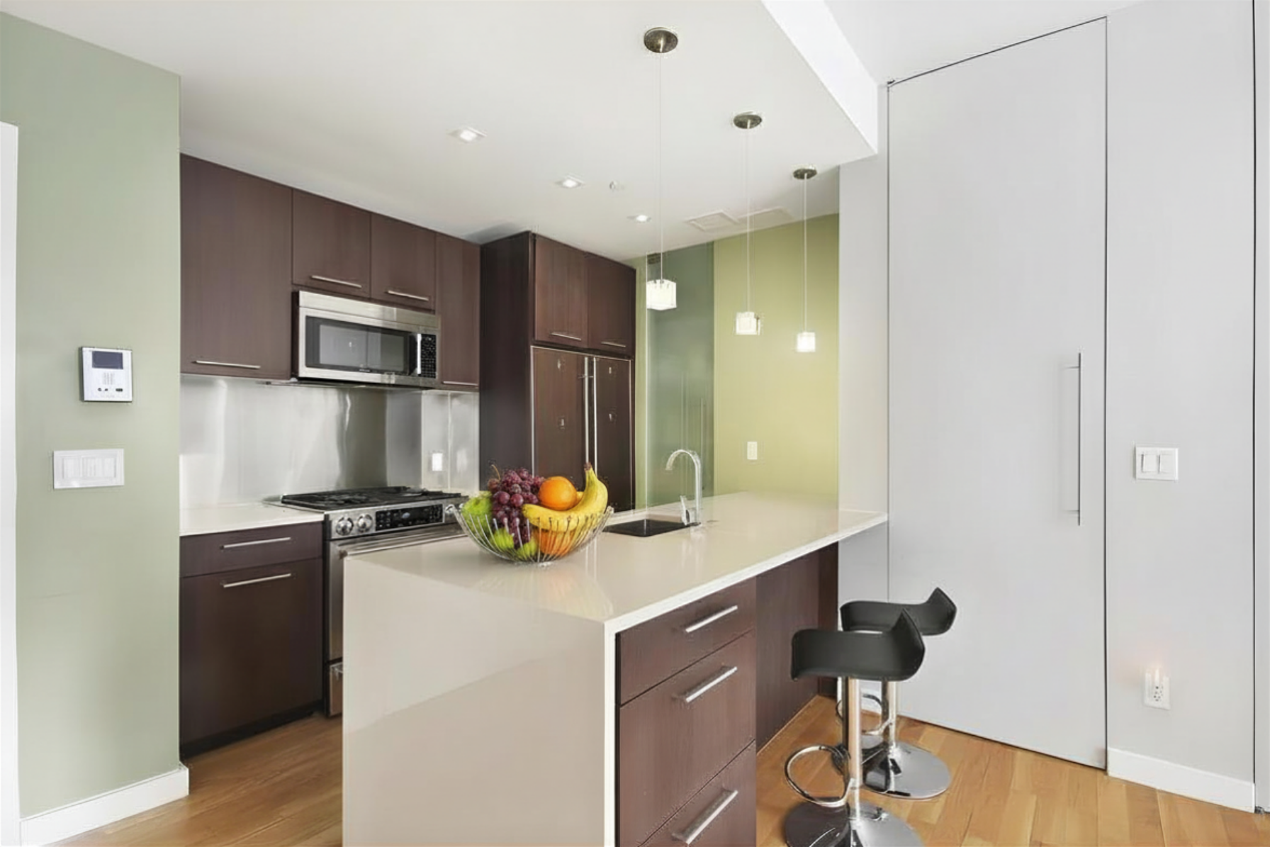 342 East 110th Street, Unit 5D Manhattan, NY 10029 - Photo 2 of 5 a kitchen with a sink appliances and cabinets