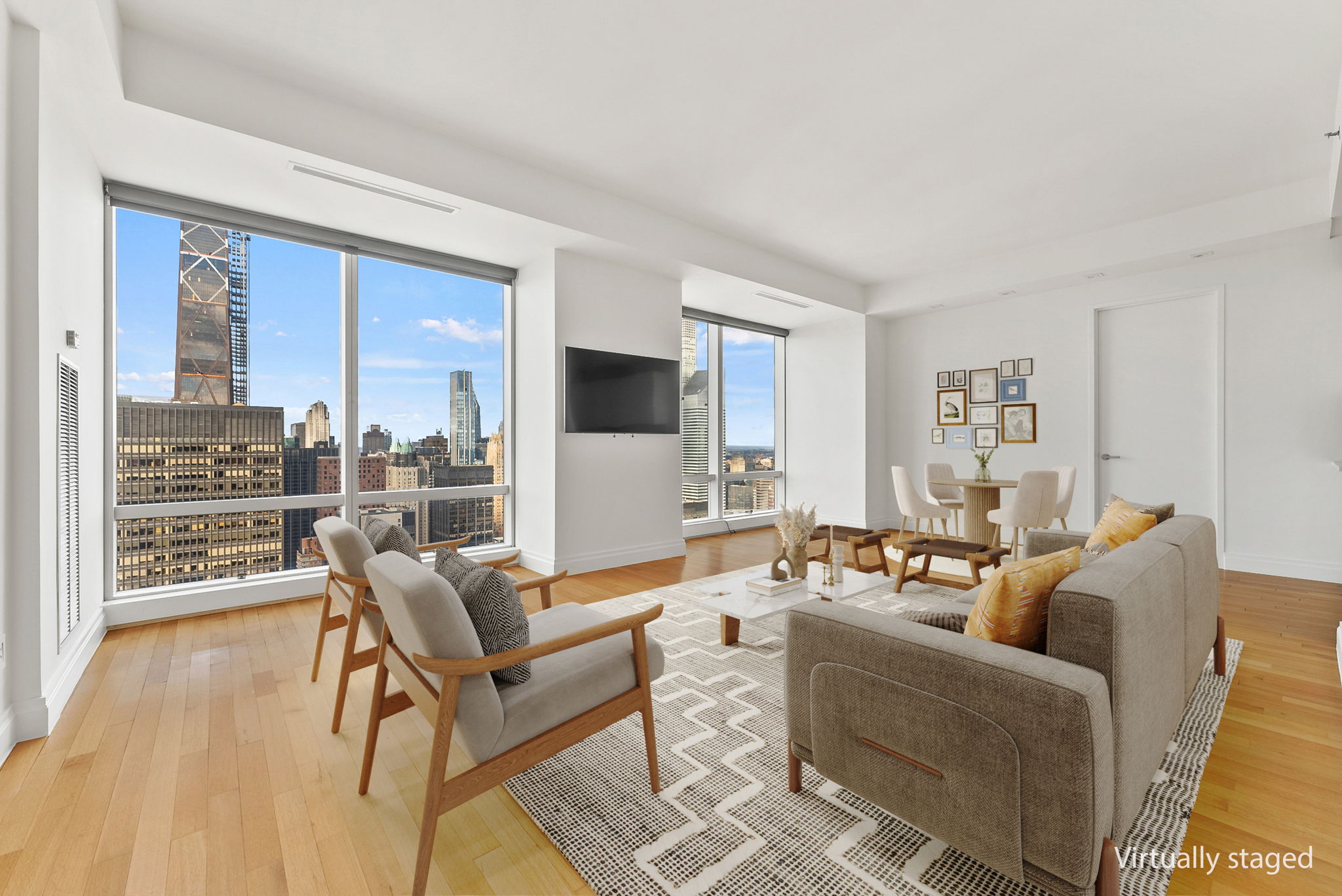845 United Nations Plaza, Unit 63D Manhattan, NY 10017 - Photo 1 of 16 a living room with furniture and a floor to ceiling window