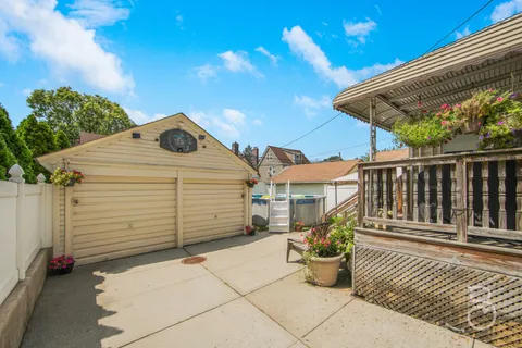 a view of a street with potted plants