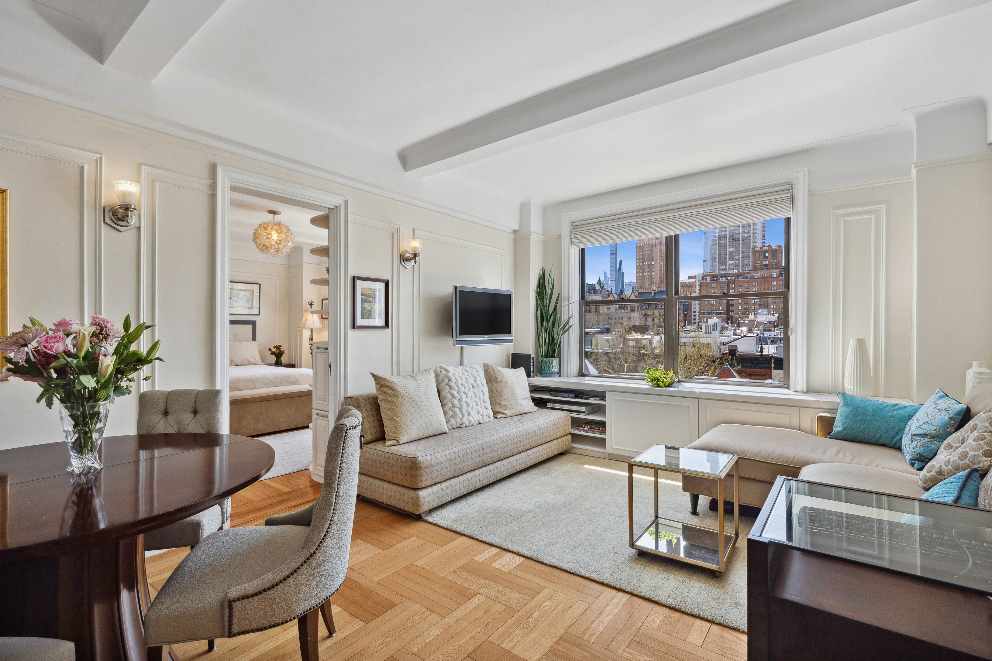 40 West 77th Street, Unit 8C Manhattan, NY 10024 - Photo 1 of 21 a living room with furniture and a large window