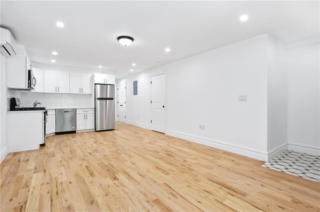 760 Decatur Street, Unit 1 Brooklyn, NY 11233 - Photo 2 of 12 a view of kitchen with wooden floor
