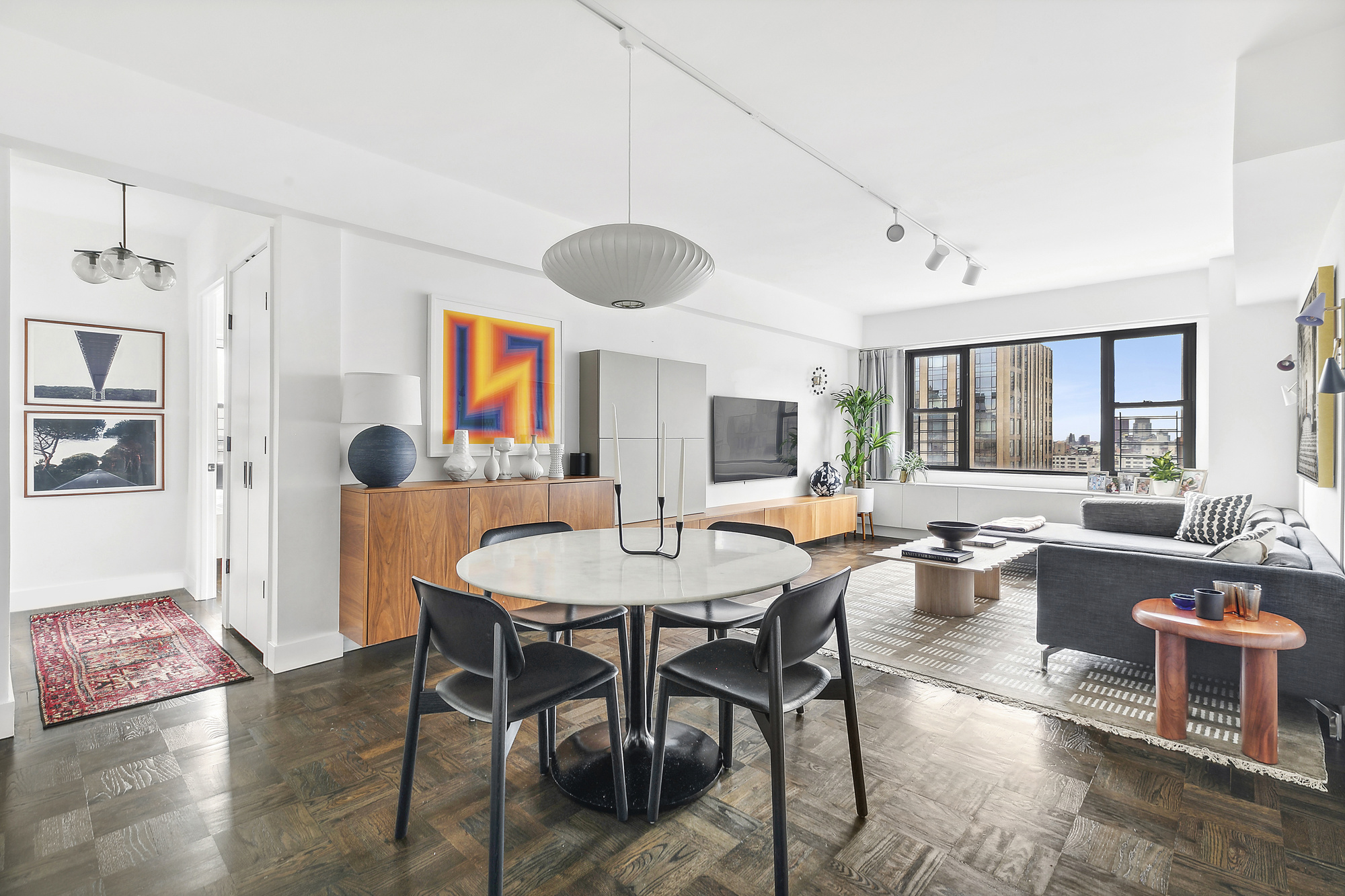 a view of a dining room that has a table and chairs