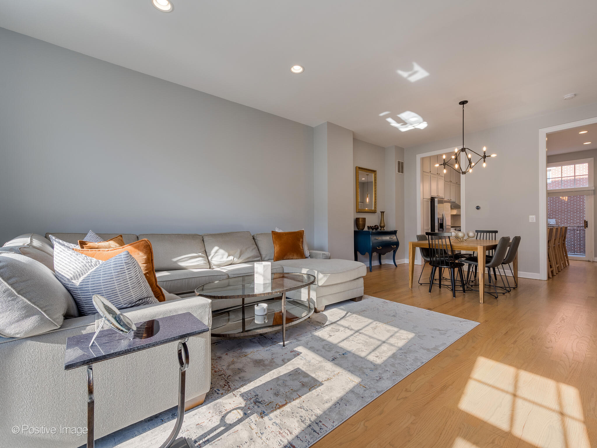 855 North May Street, Unit G Chicago, IL 60642 - Photo 9 of 28 a living room with furniture and wooden floor