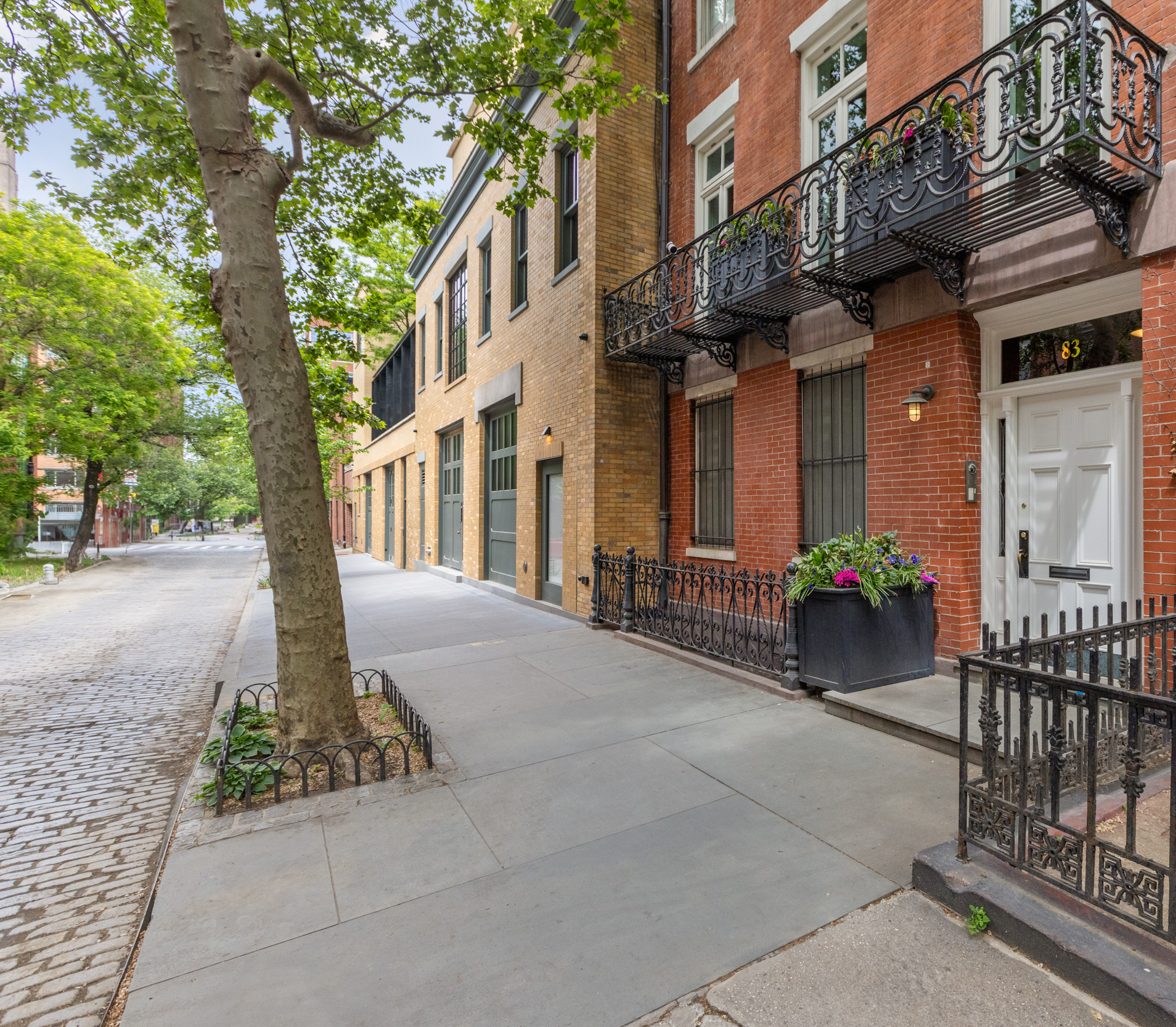 83 Jane Street, Unit TH1 Manhattan, NY 10014 - Photo 28 of 29 a front view of a building with street view