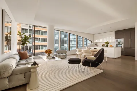 a living room with furniture and a table