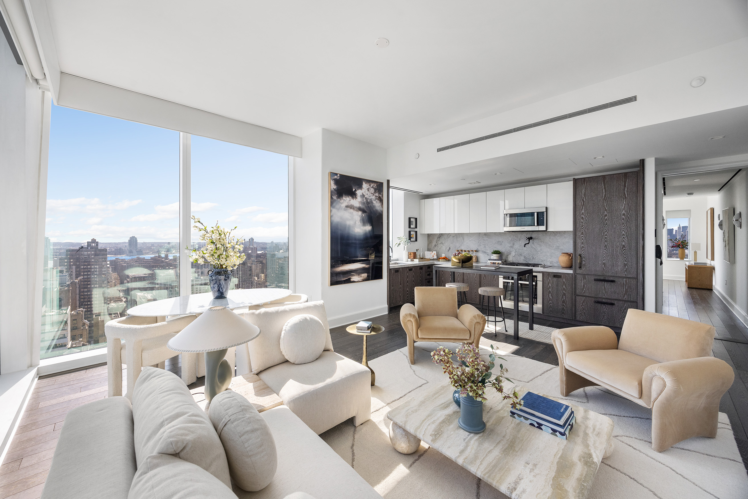45 East 22nd Street, Unit 32B Manhattan, NY 10010 - Photo 2 of 36 a living room with furniture kitchen view and large windows