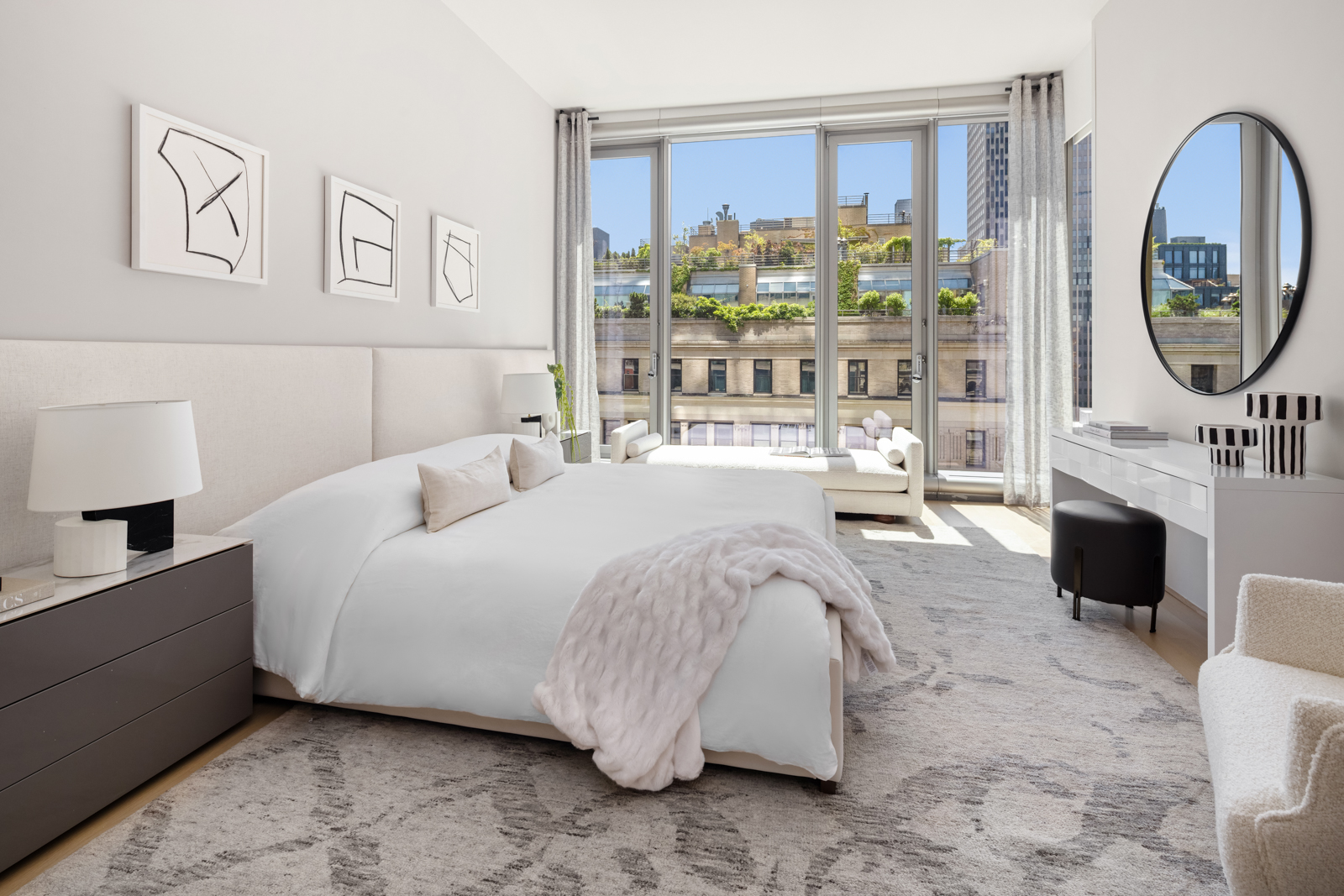 56 Leonard Street, Unit 14BEAST Manhattan, NY 10013 - Photo 11 of 35 a bed sitting in a spacious bedroom next to a window