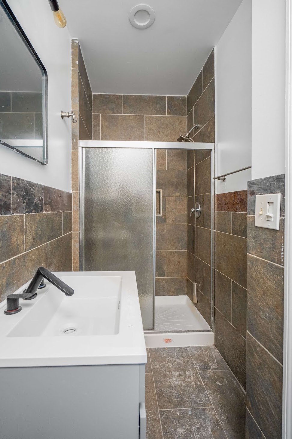 185 A Powers Street, Unit 3 Brooklyn, NY 11211 - Photo 8 of 12 a bathroom with a sink toilet and shower