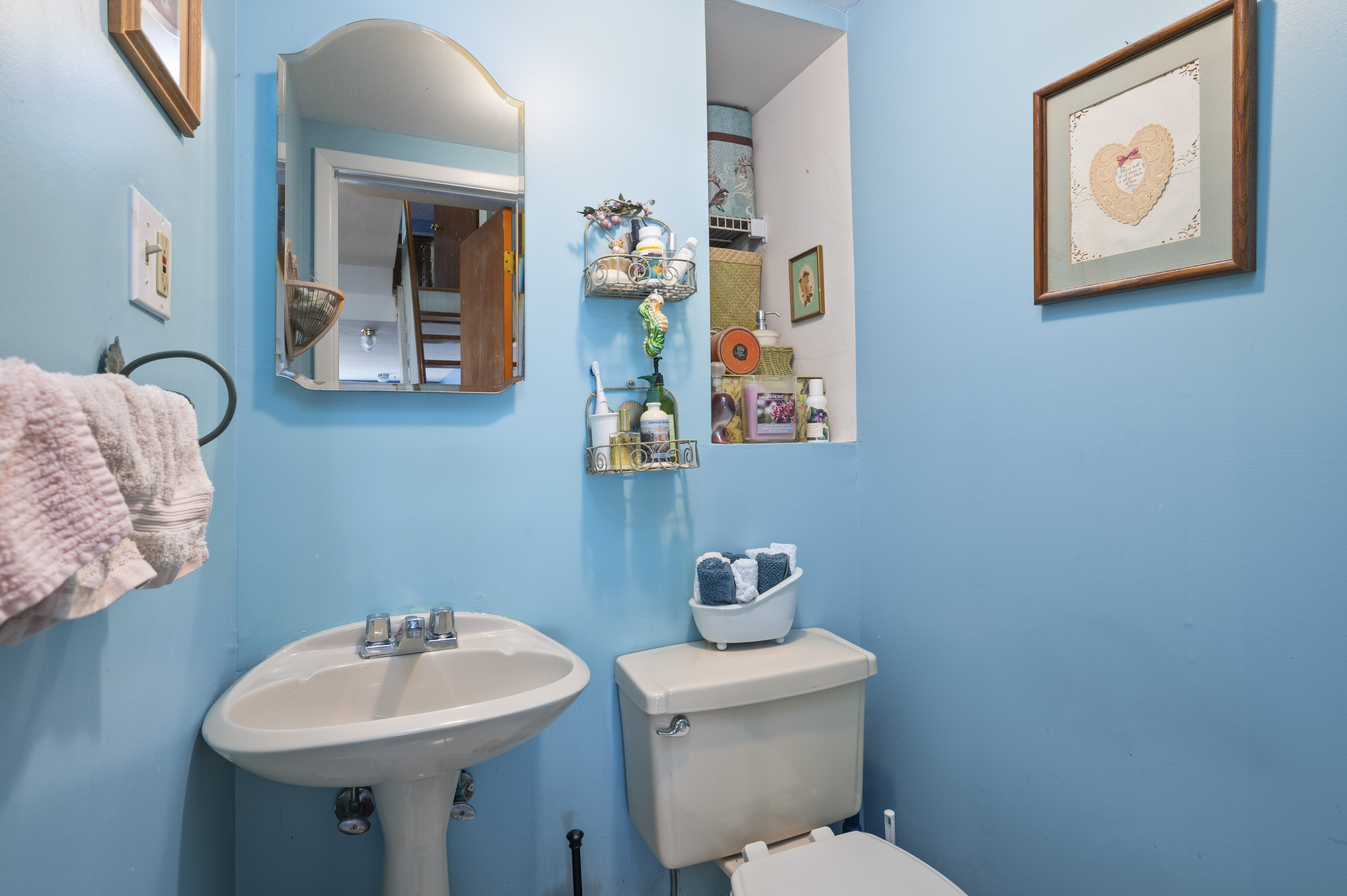 20 Eric Lane Staten Island, NY 10308 - Photo 10 of 20 a bathroom with a toilet sink and mirror