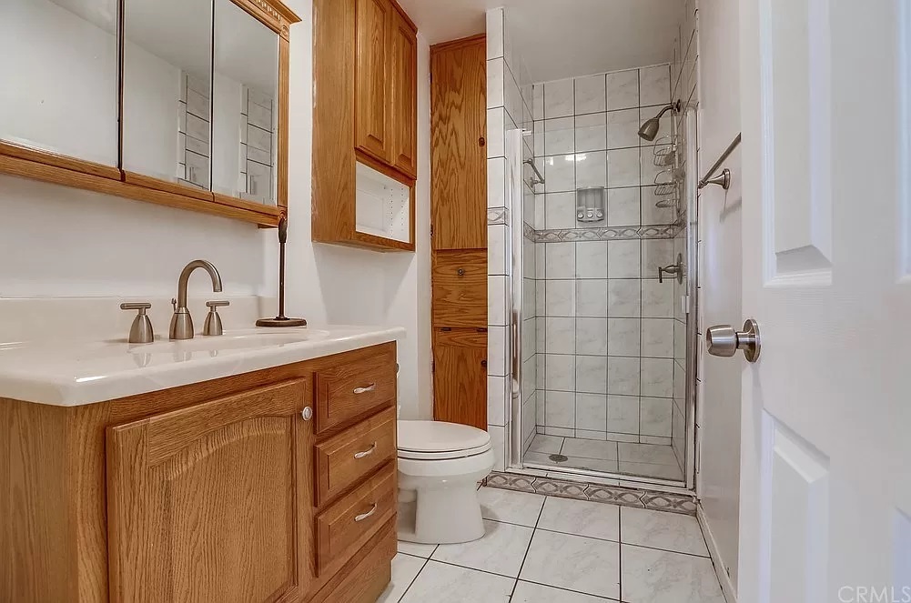 15604 Deblynn Avenue Gardena, CA 90248 - Photo 10 of 22 a bathroom with a sink a toilet and shower
