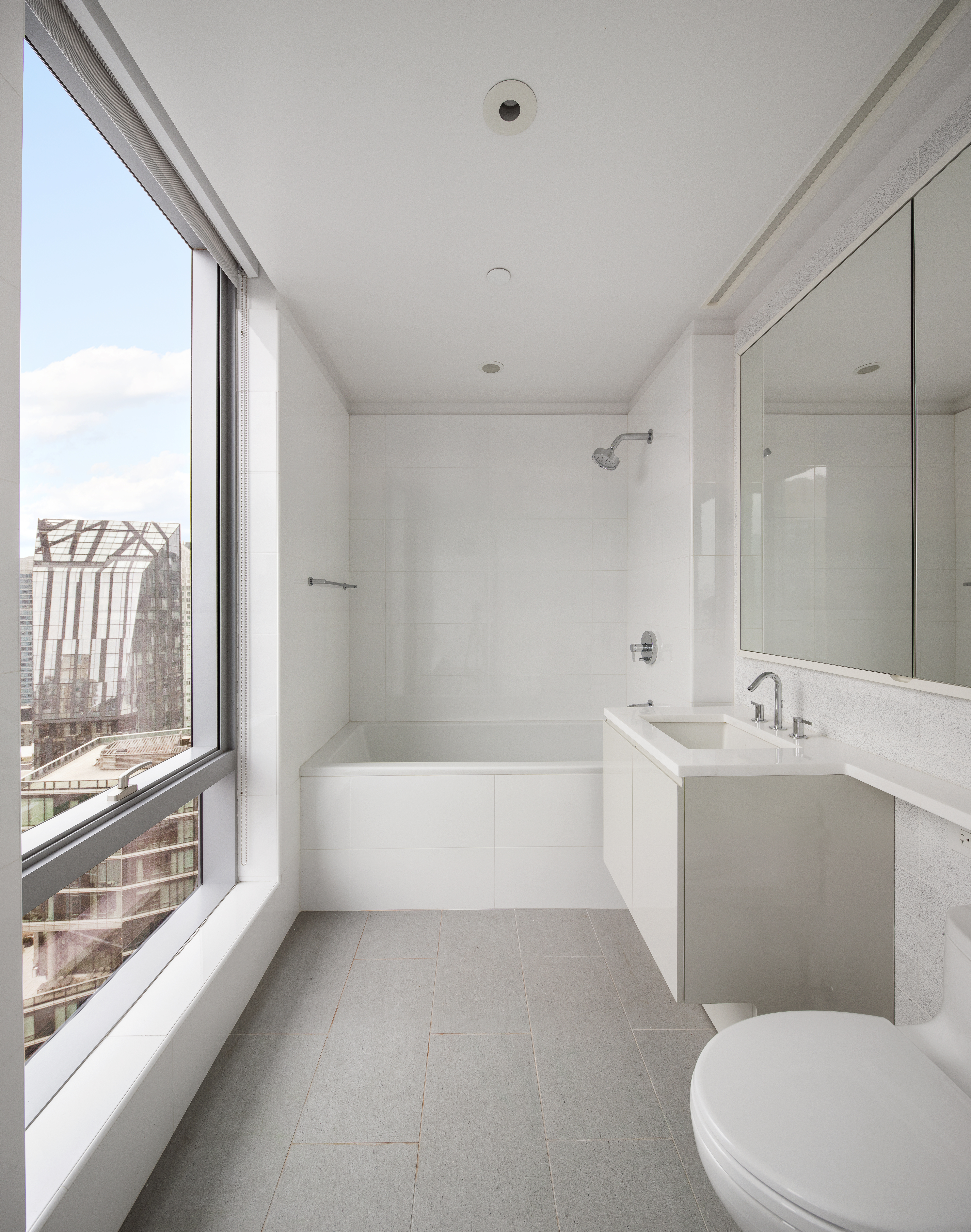 50 Riverside Boulevard, Unit 30B Manhattan, NY 10069 - Photo 10 of 14 a bathroom with a sink a toilet and bathtub