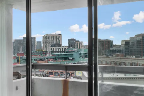 a city view from a balcony with city view