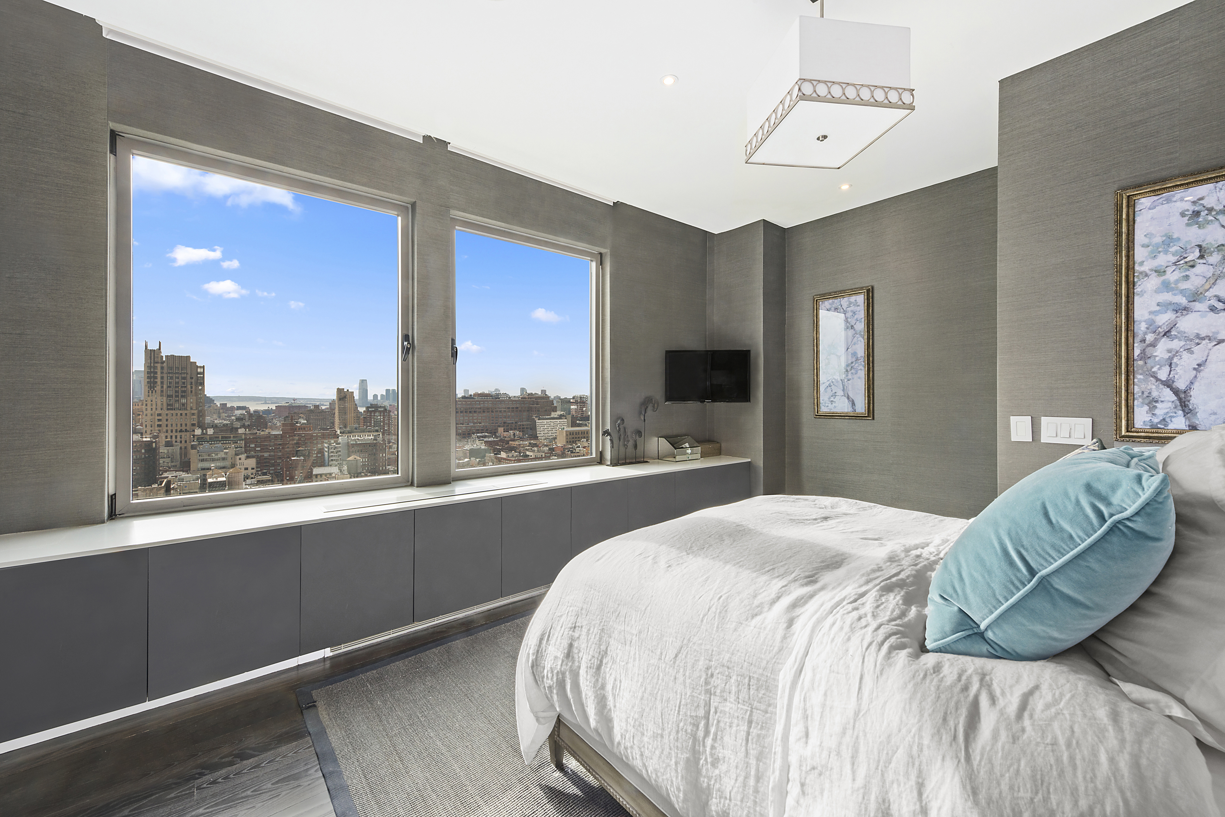 252 7th Avenue, Unit PHD Manhattan, NY 10001 - Photo 13 of 26 a bedroom with a bed and a large window