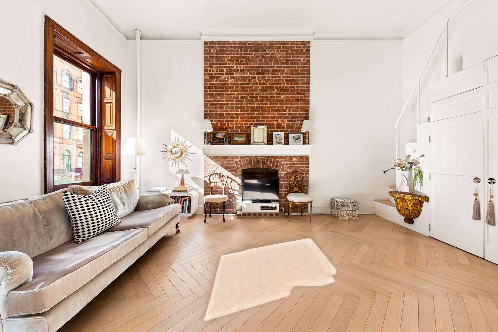 133 West 75th Street, Unit PARLOUR A Manhattan, NY 10023 - Photo 2 of 11 a living room with furniture and a fireplace
