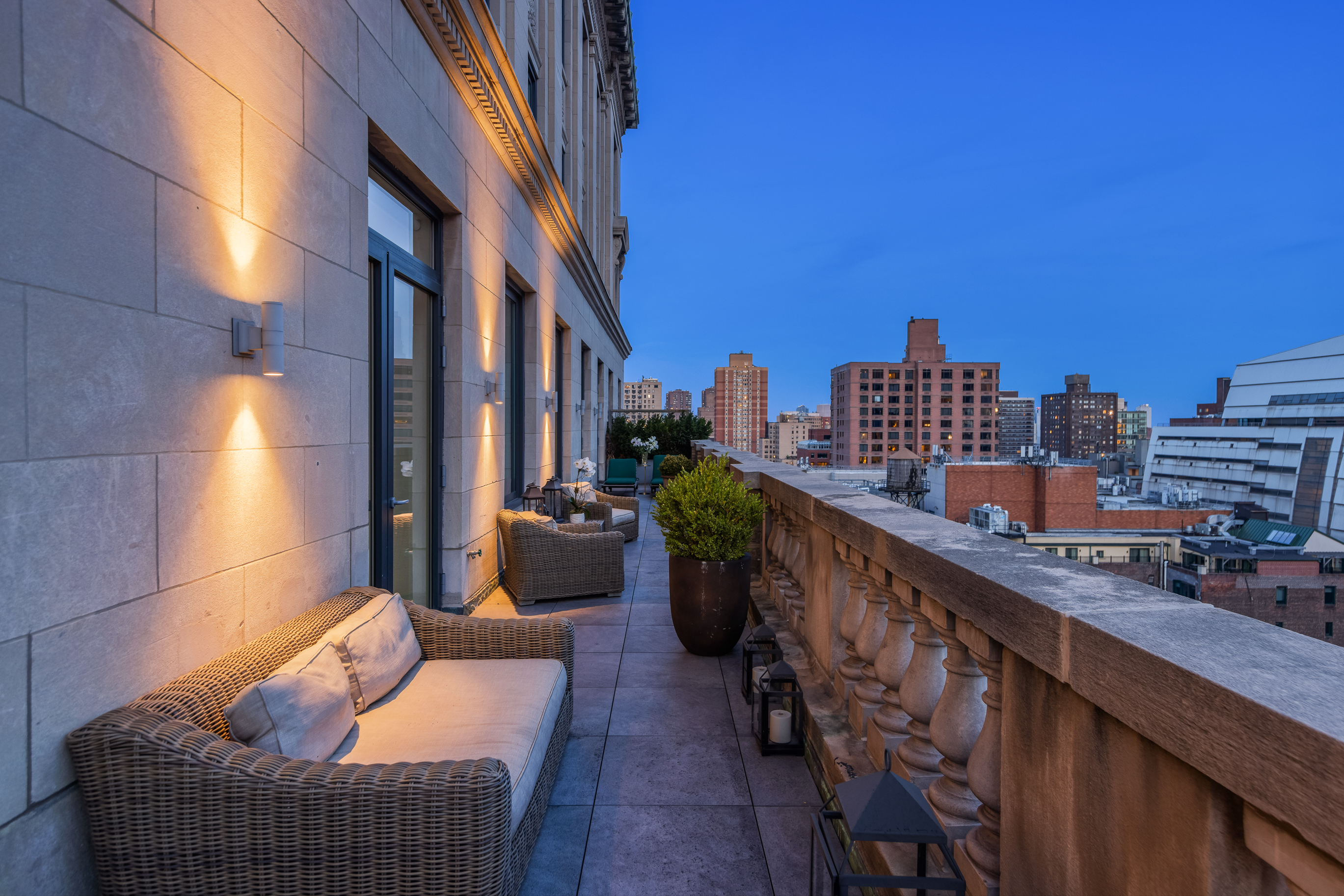 88 Lexington Avenue, Unit 1606 Manhattan, NY 10010 - Photo 19 of 20 a balcony with furniture and a potted plant