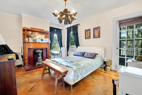 a bed room with furniture and a chandelier