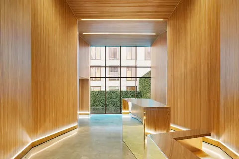 a view of a chairs and table in patio