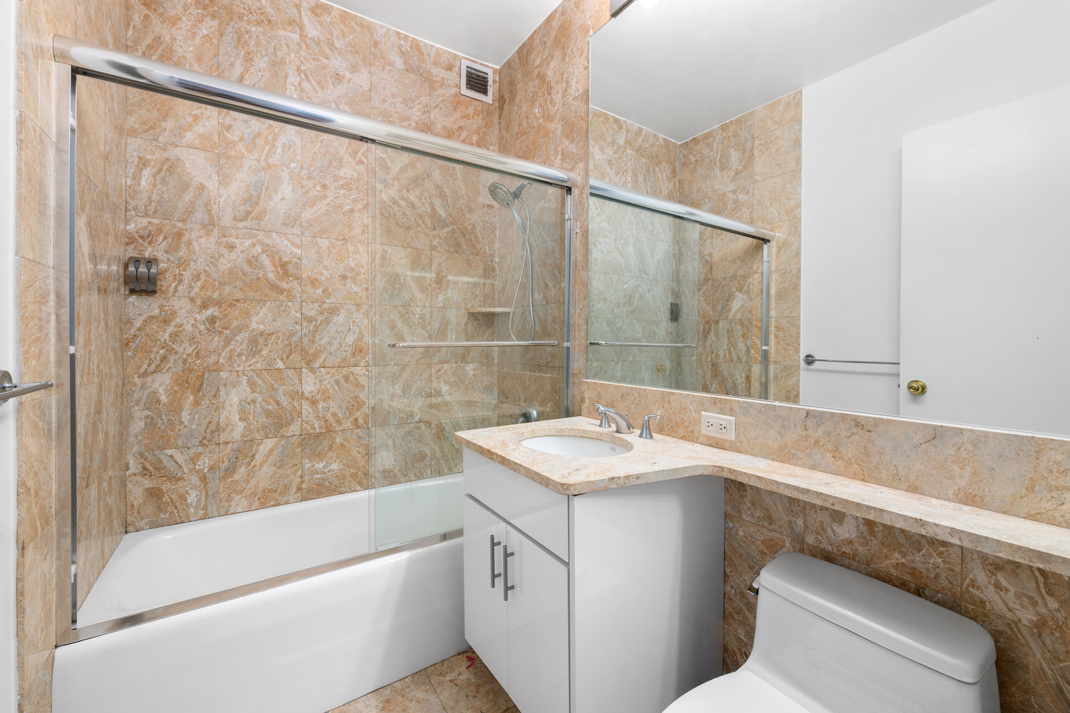 200 Riverside Boulevard, Unit 9F Manhattan, NY 10069 - Photo 5 of 12 a bathroom with a sink and a bathtub