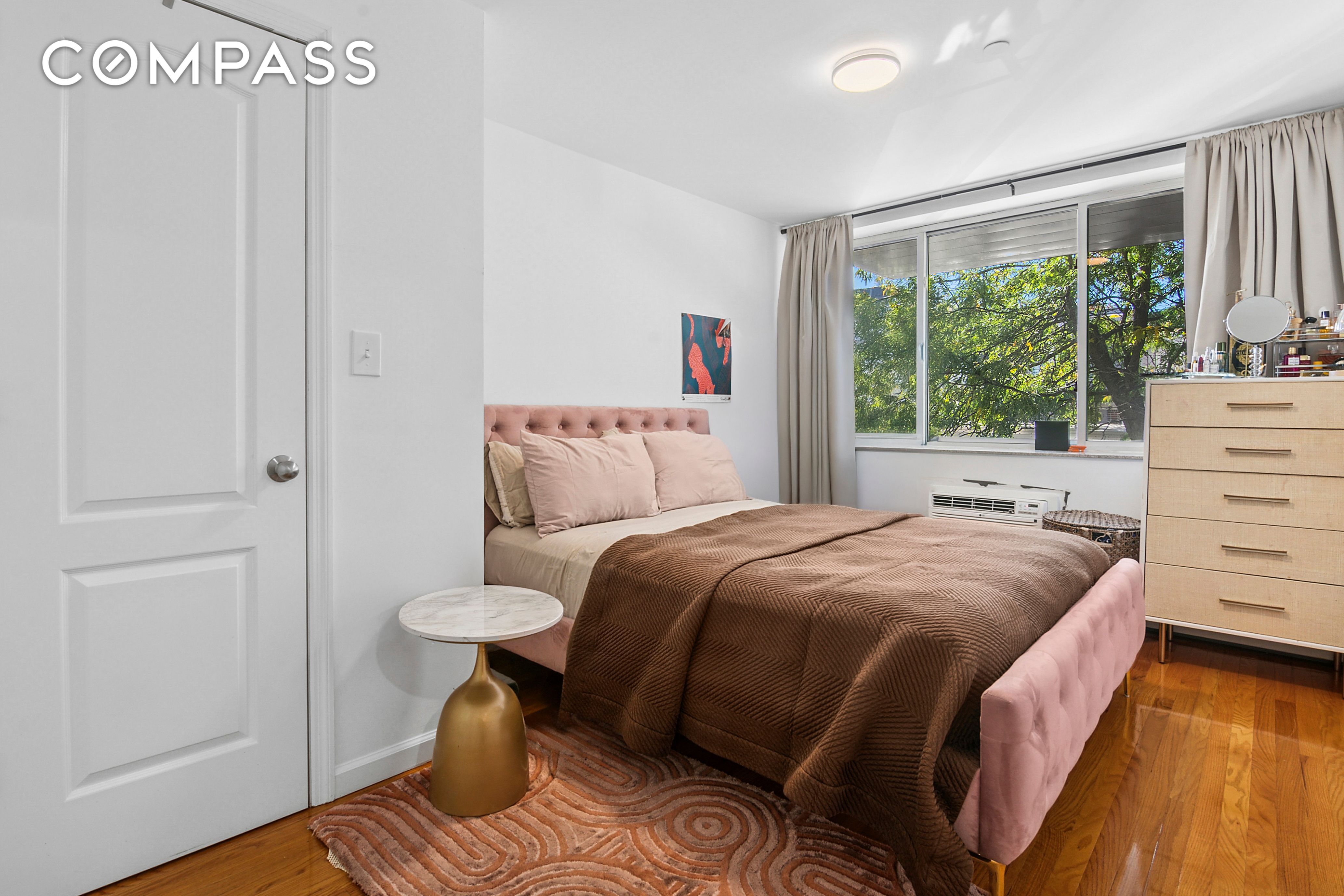 145 Kenilworth Place, Unit 2A Brooklyn, NY 11210 - Photo 3 of 7 a bedroom with a bed and a window