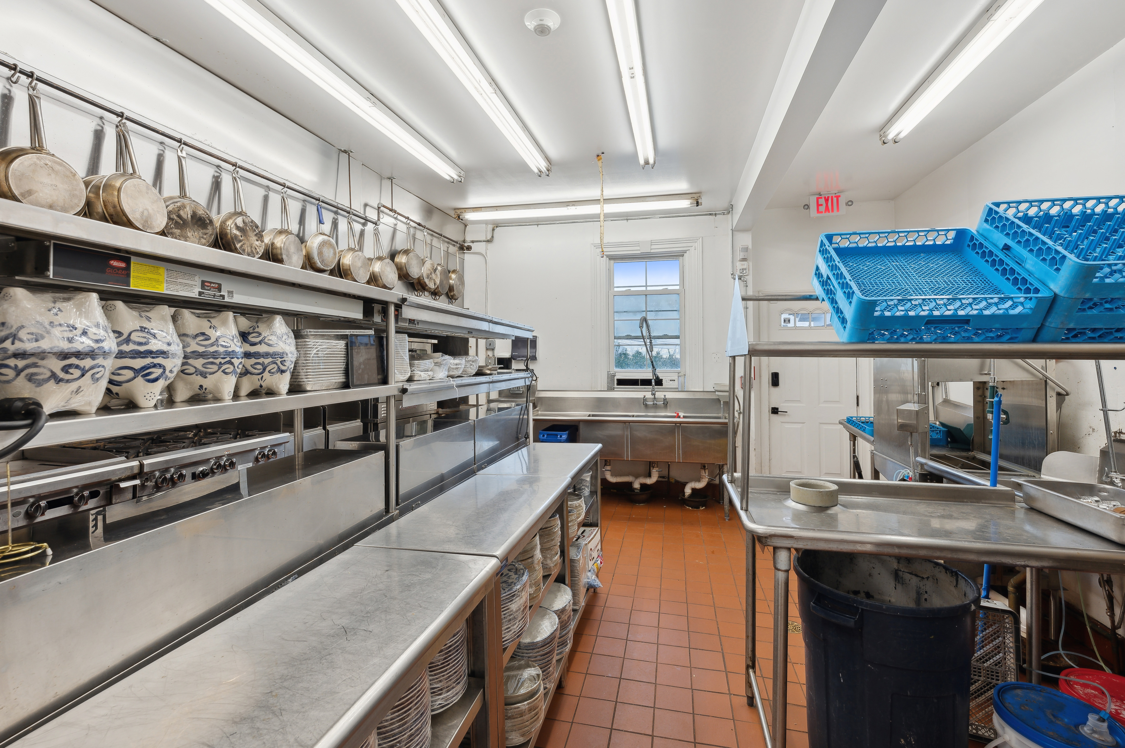 32 Lighthouse Road Hampton Bays, NY 11946 - Photo 38 of 51 a kitchen with stainless steel appliances granite countertop a stove and a sink