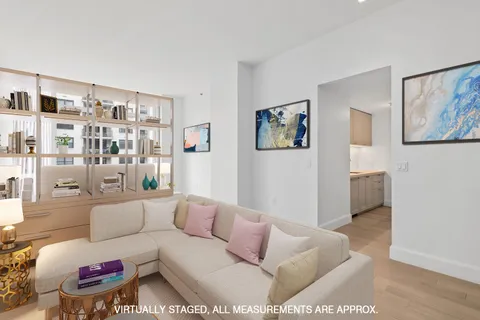 a living room with furniture and a rug