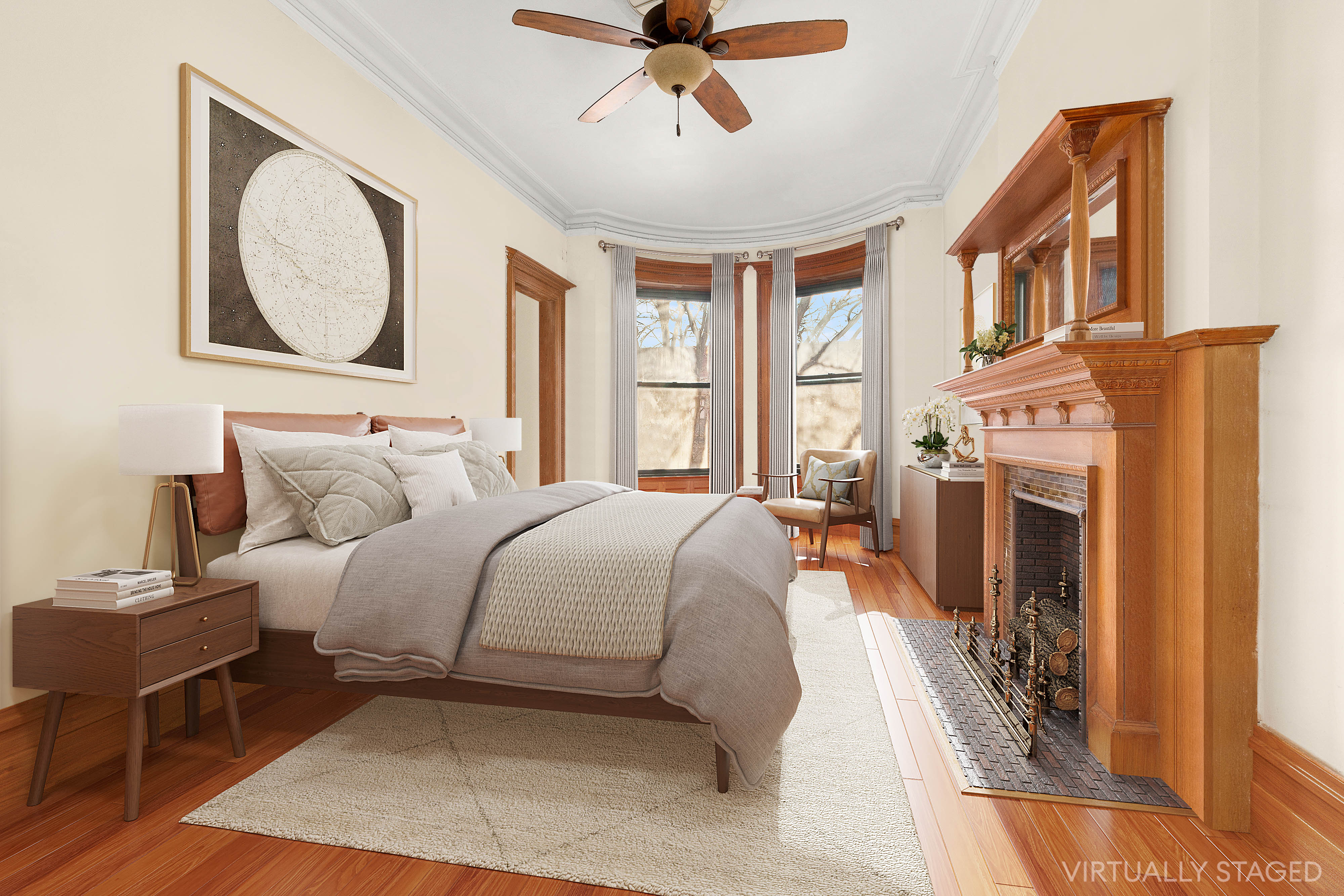 117 West 120th Street Manhattan, NY 10027 - Photo 25 of 31 a bedroom with a bed a fireplace and a chandelier