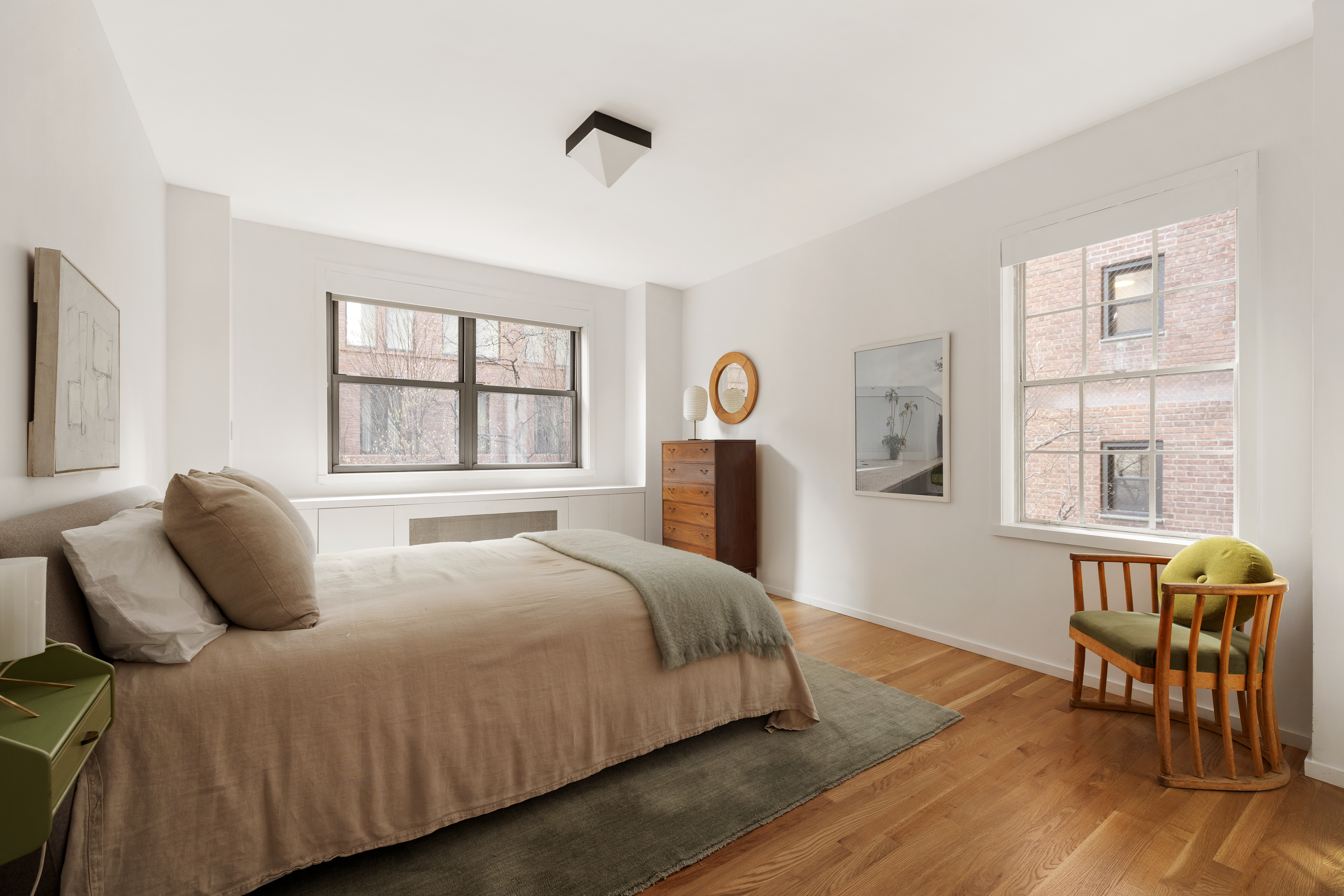 2 Horatio Street, Unit 2PR Manhattan, NY 10014 - Photo 11 of 14 a bedroom with a bed and wooden floor