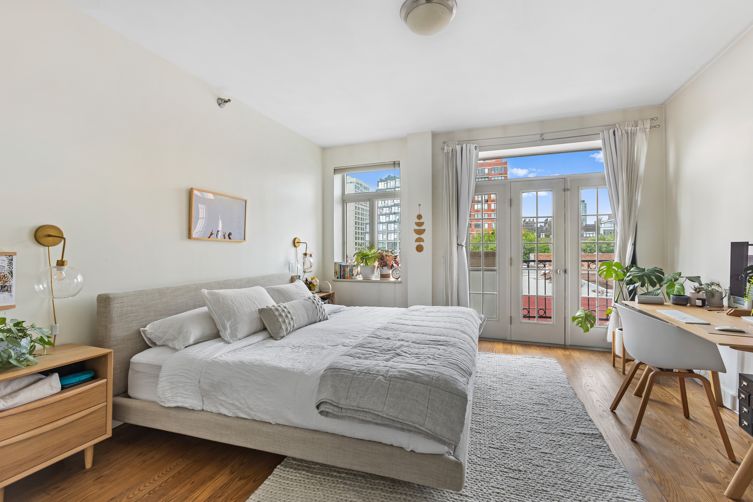310 2nd Street, Unit 3C Brooklyn, NY 11215 - Photo 8 of 14 a bedroom with a bed and a large window