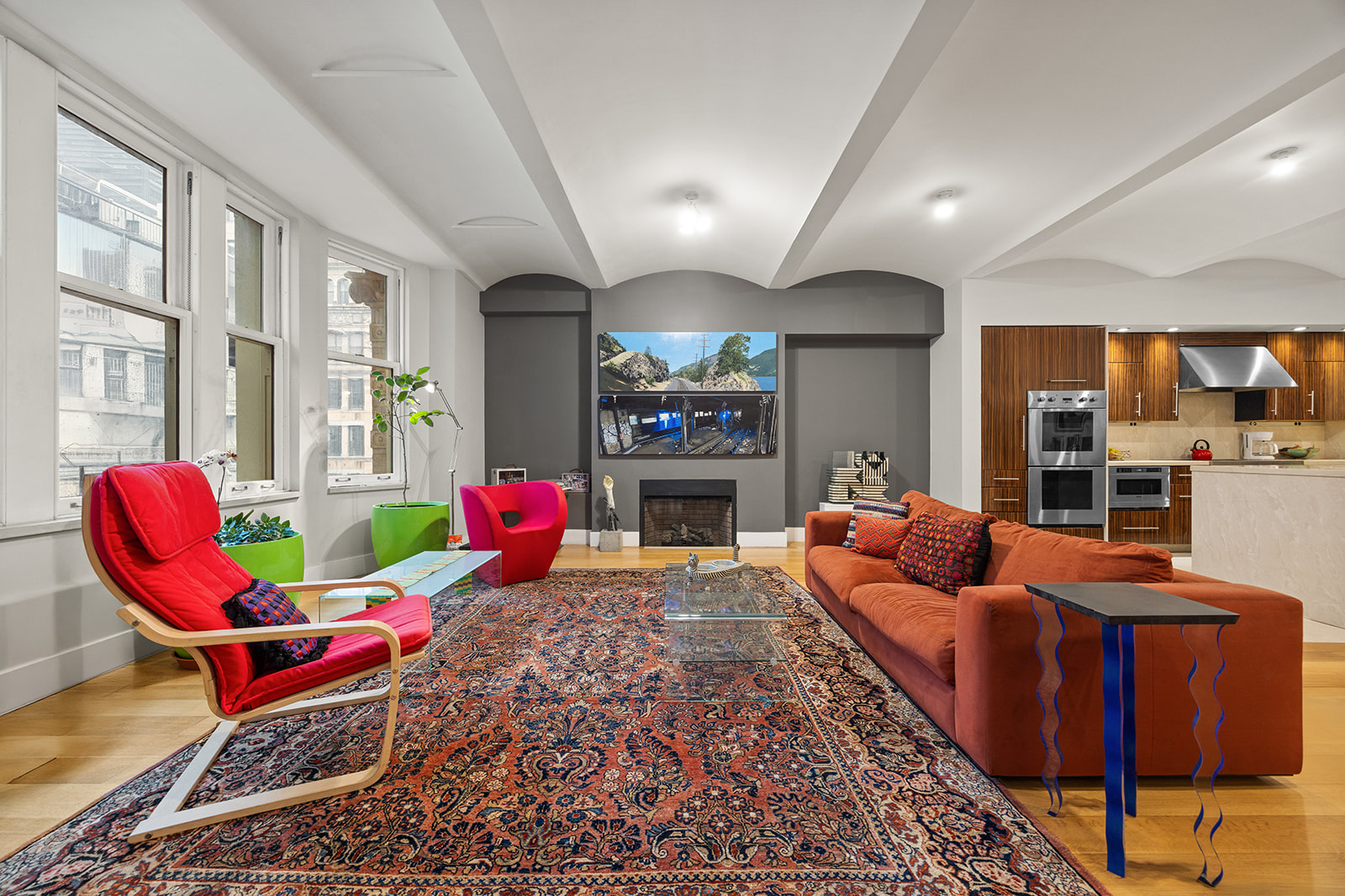 42 Ann Street, Unit 7 Manhattan, NY 10038 - Photo 2 of 16 a living room with furniture a rug and a fireplace