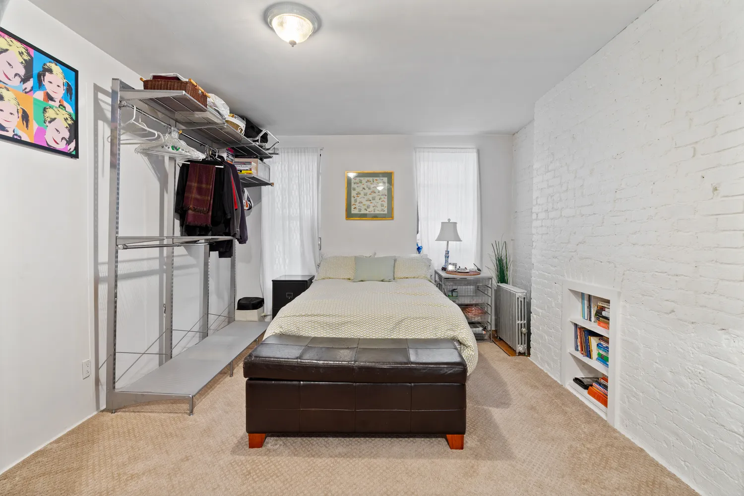 a bed room with a bed and a television