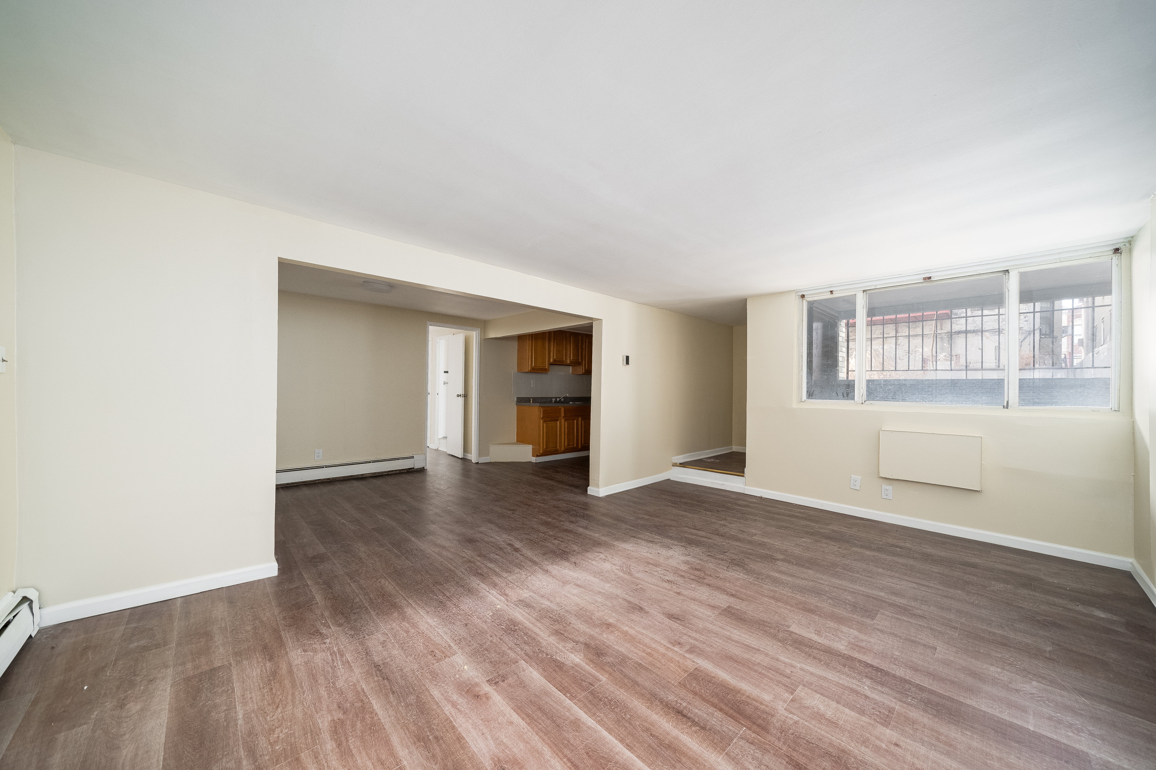 100-108 35th Street Union City, NJ 07087 - Photo 5 of 17 an empty room with wooden floor and windows