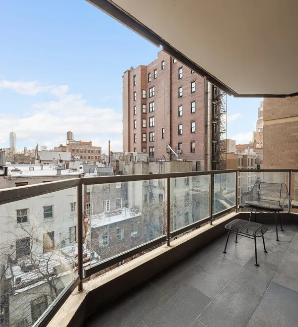 a view of a balcony with chairs