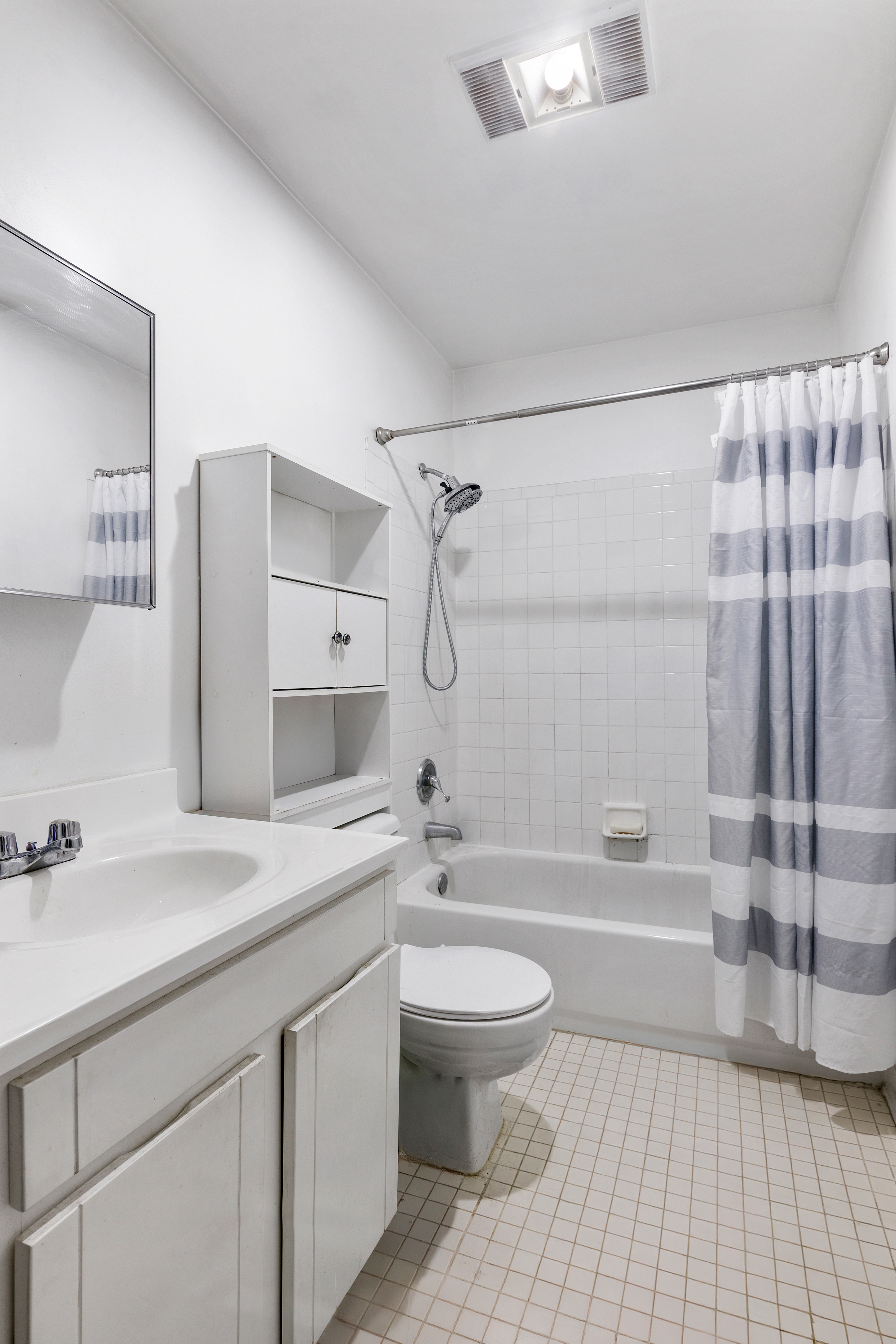 364 Chauncey Street Brooklyn, NY 11233 - Photo 8 of 17 a bathroom with a granite countertop sink a toilet and shower